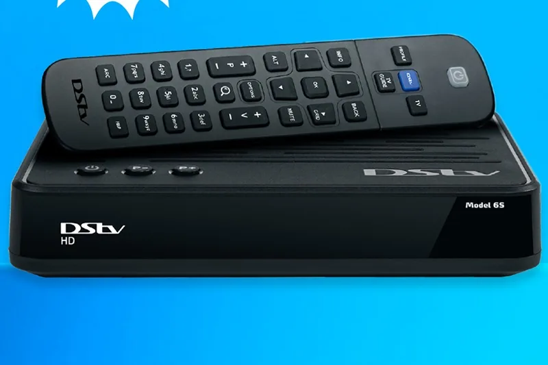 New DSTV decoder being installed and connected to a television