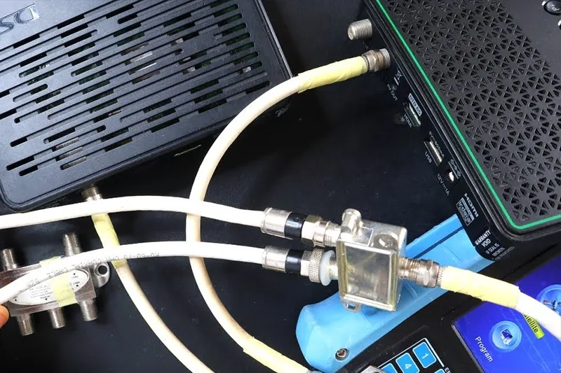 Installer configuring linked decoders for DSTV Extra View