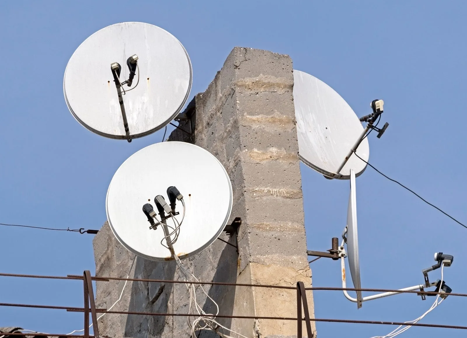 Multi-room DSTV setup with televisions in different rooms of a home